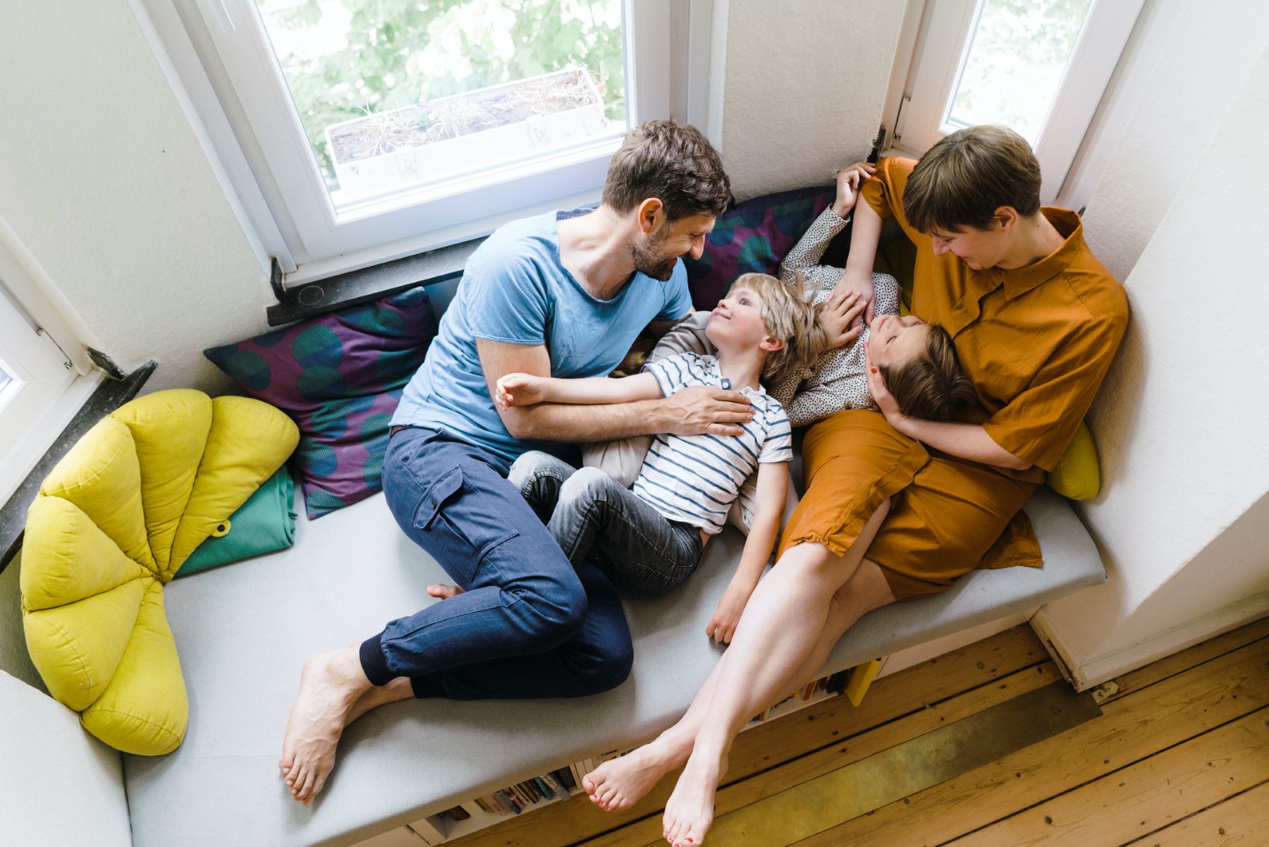 seen from above, a family relaxing together