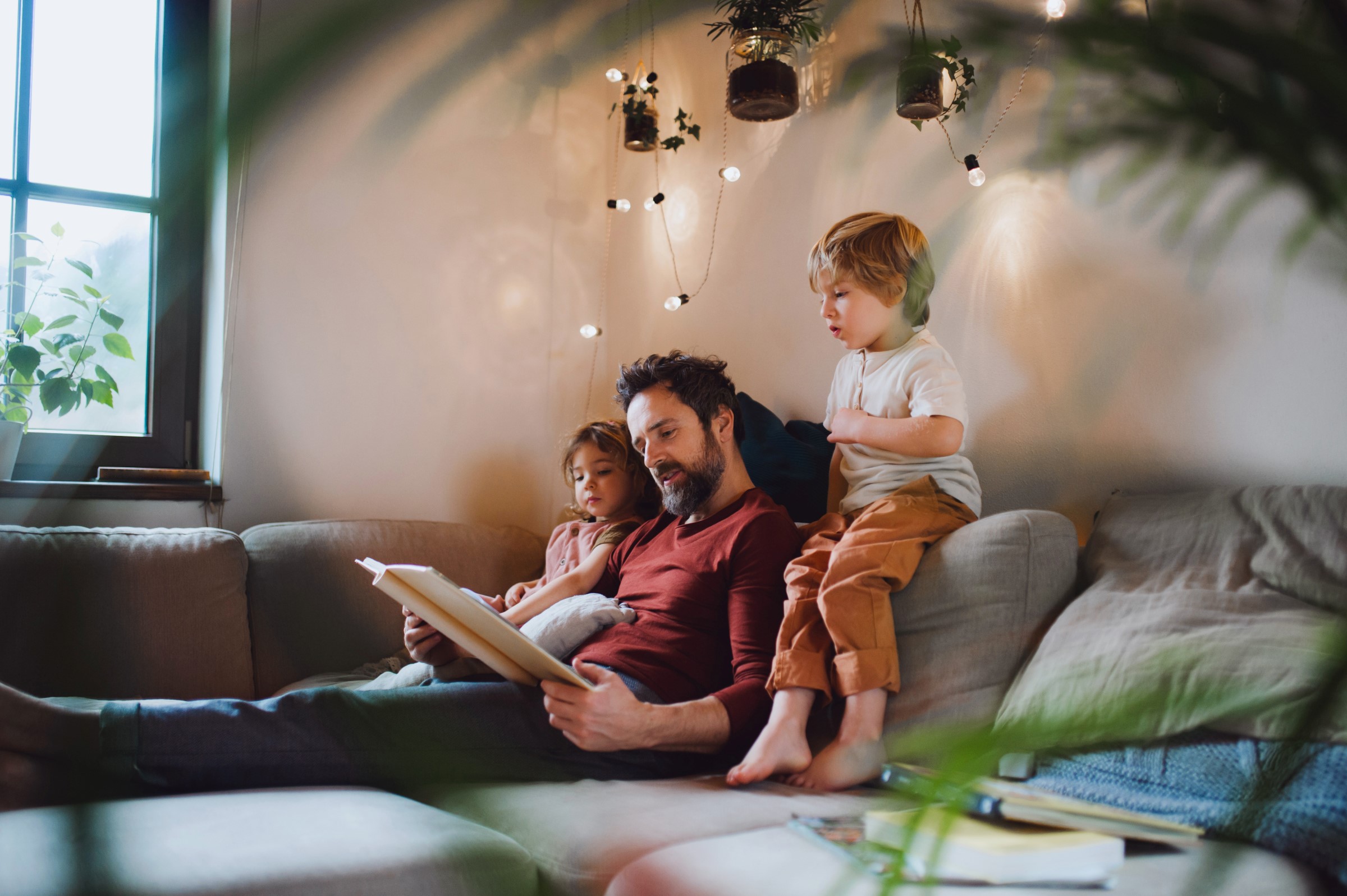 father reading to his two children