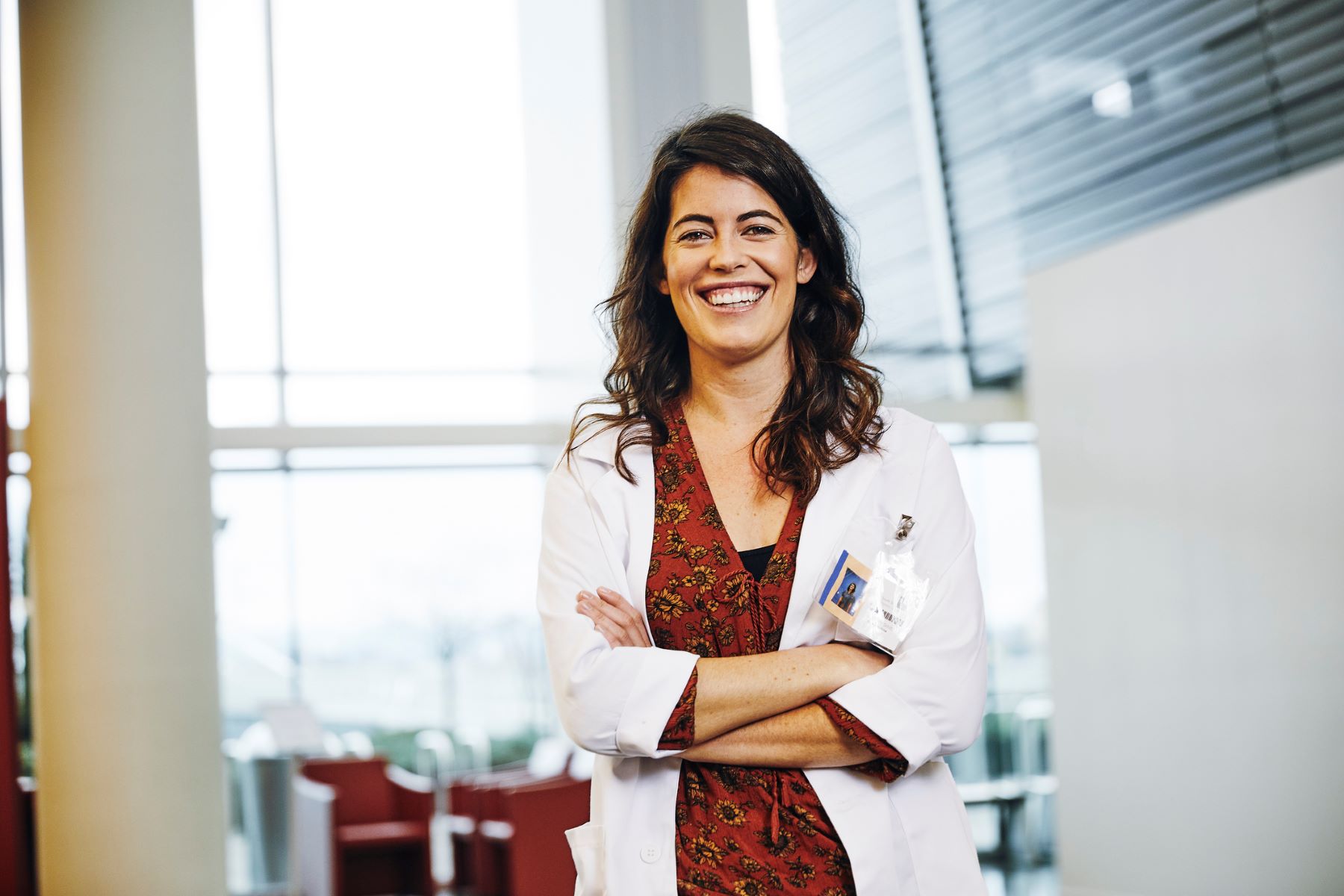 Smiling female doctor with arms folded